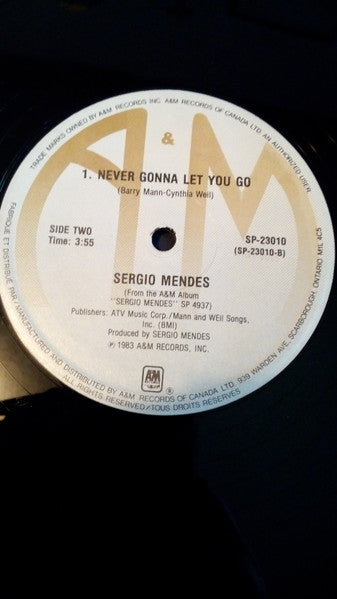 Sérgio Mendes – Voo Doo/Never Gonna Let You Go - 1983-Jazz, Funk / Soul, Pop (12", 33 ⅓ RPM)